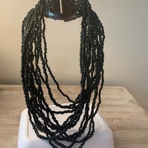 Beaded necklace with wood closure